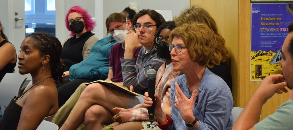 People seated and speaking.